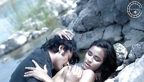 Hot brunette milf with big tits is going to ride a rock