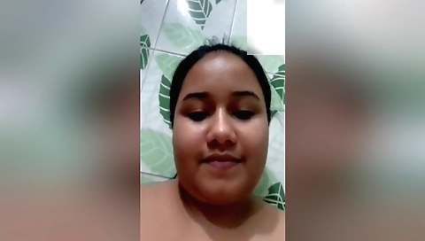 Chubby brunette shows her big booty and takes a shower