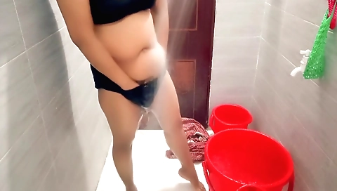 Indian chick gets dressed in the shower and stretches