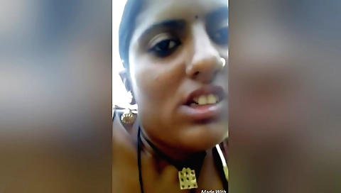 Indian porn video shows a brunette girl showing off her big tits