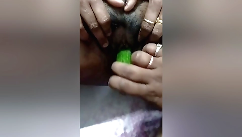 Indian girl is playing with her toy in her hairy pussy