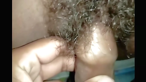 Hairy brunette girl fucks with a dildo in amateur porn video