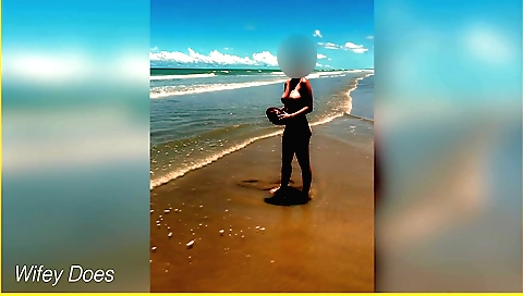 Slender blond woman plays footballs with her boyfriend