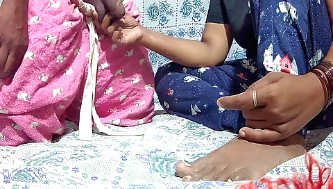 Handjob video of two horny Indian women with very long legs