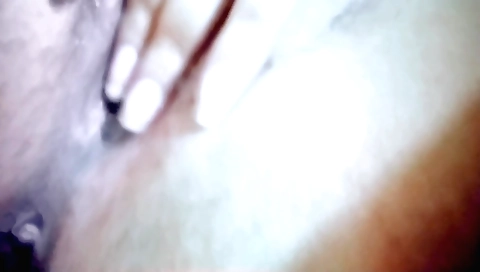 Indian beauty playing with her beautiful face in her room