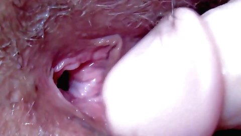 Hairy teen with an shaved pussy fucks in a solo video