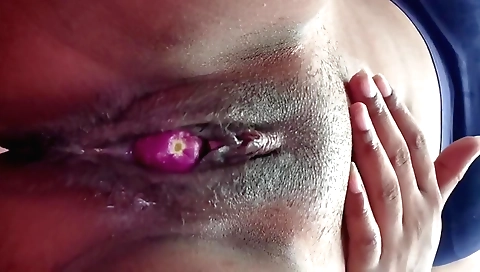 Indian girl is having fun with a vibrator on her pussy