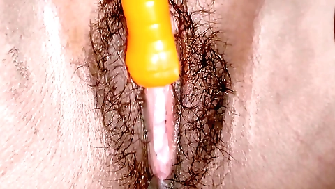 Indian hairy babe masturbates while sucking the vibrator