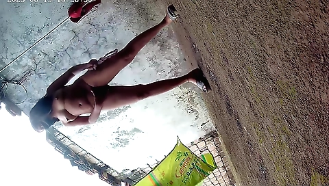 Indian girl naked on the grass in a solo outdoor scene